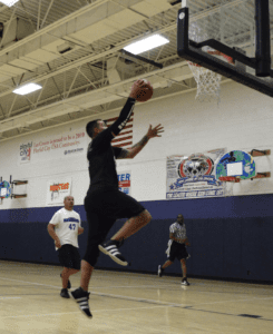 Men playing basketball